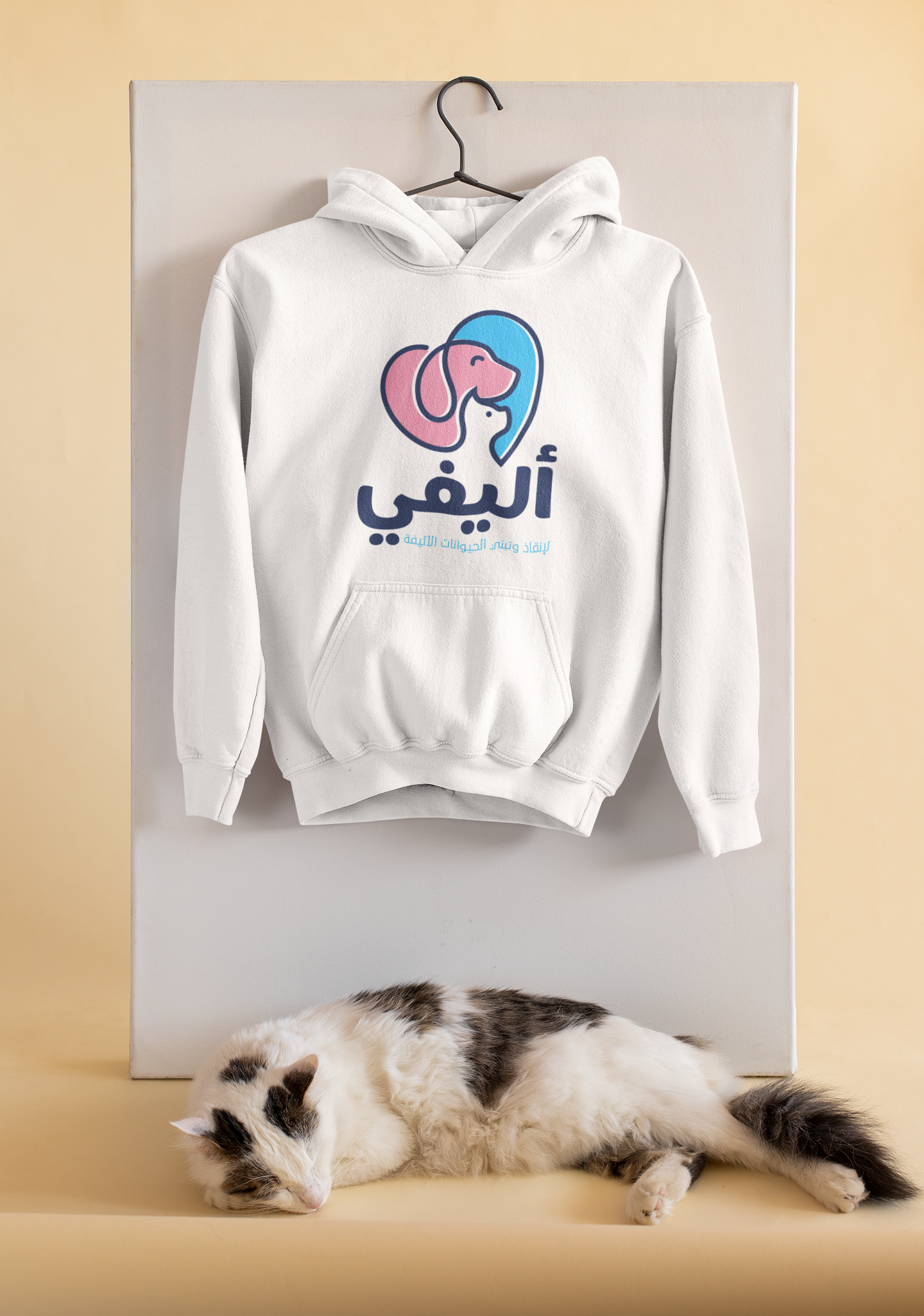 mockup-of-a-pullover-hoodie-hanging-by-a-sleeping-cat-33755